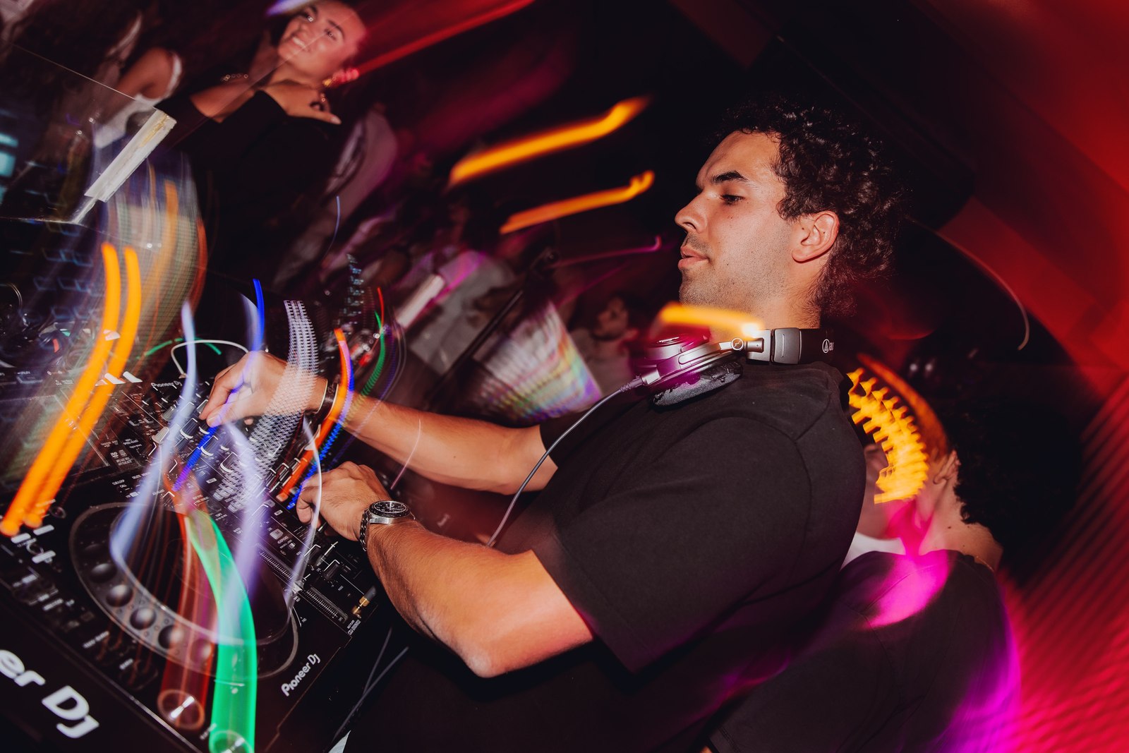 Jake Veeneman mixing under club lights